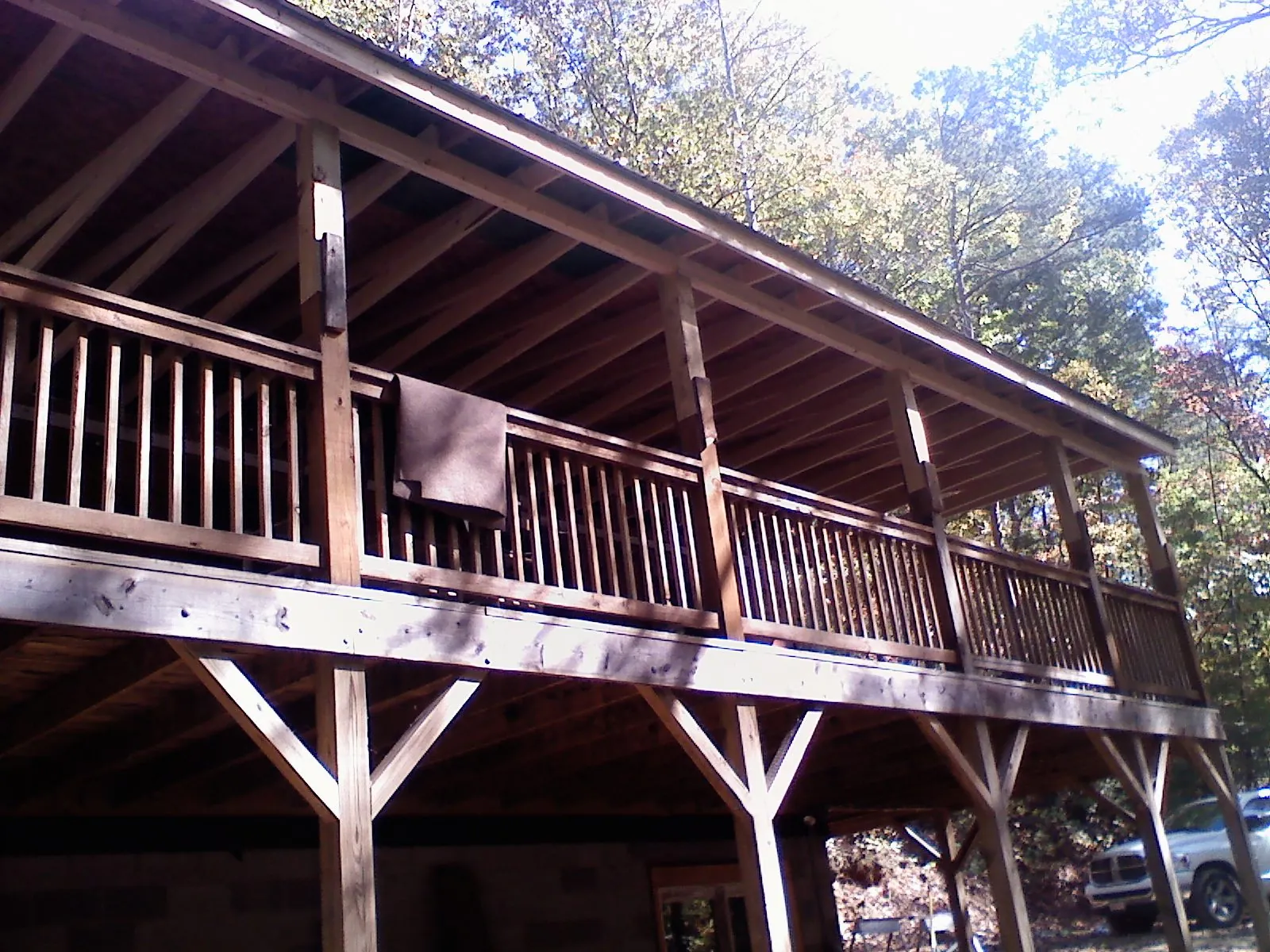 Timber framing under a new elevated porch and deck — Roof Leak Repair in Greenfield Center by Roofing Brothers